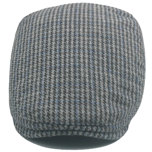 Classic houndstooth wool tweed flat cap with subtle blue accents on white background