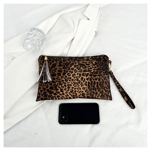 Chic leopard print envelope clutch bag with black wristlet strap and stylish tassel detail