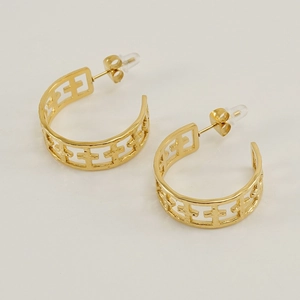 Minimalist hollow cross pattern gold hoop earrings with smooth metallic finish on white background