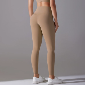 Close-up of high-waisted fitness leggings showing elastic khaki matte fabric and fit