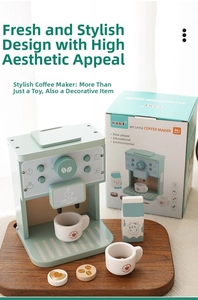 Detail of mint green wooden toy coffee maker set with cups and milk carton accessories