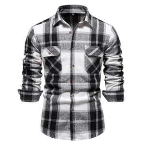 Detail of grey plaid flannel shirt featuring dual chest pockets and button-down cuffs