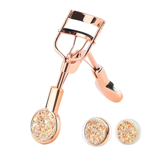 Rose gold eyelash curler set with glitter accents and two matching replacement pads