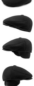 Detail view of black thermal flat cap with earflaps and thick wool texture