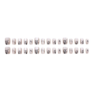 Cat-eye pearly nude pink press-on nails with black ink bamboo and butterfly patterns