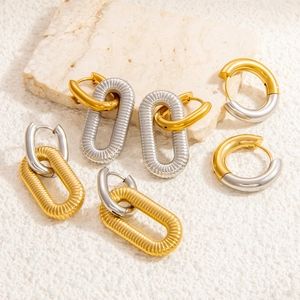 Minimalist round and oval stainless steel earrings with gold and silver metallic texture