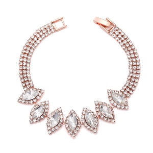 Close-up of rose gold bracelet featuring three rows of cubic zirconia and marquise stones