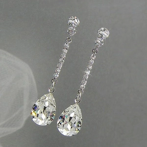 Elegant pear-shaped drop earrings featuring sparkling AAA cubic zirconia on silver metal