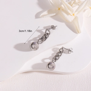Silver chain earrings with ball pendant and 3cm measurement indicator on white petals
