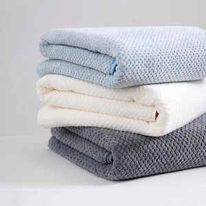 Three-piece coral fleece towel set with pineapple grid texture in blue, white and grey