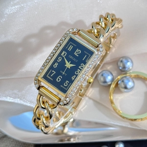 Elegant gold chain watch for women with rectangular blue dial and sparkling crystal bezel