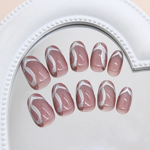 Pink cat eye press on nails with 3D silver fluid lines in oval shape and glossy finish