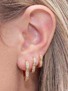 Close-up of gold plated ear cuff set with pavé cubic zirconia worn in a gradient style