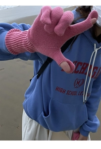 Detail of pink wool knit long gloves with thumb hole design for windproof warmth