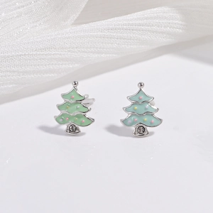 Close-up of S925 silver Christmas tree stud earrings with green enamel and tiny crystals