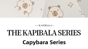 Detail shot of cute brown Kapibala character prints and stars on the white umbrella surface
