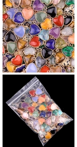 Detailed view of heart-shaped natural gemstone connectors with gold-plated edges in bulk
