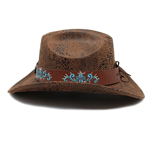 Detail of brown snakeskin western hat with turquoise floral embroidery on leather band