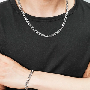 Polished silver stainless steel Figaro necklace and bracelet set worn by male model