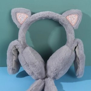 Detail of plush grey ear muffs with pink sequined cat ears and soft fluffy texture