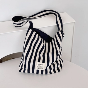 Close-up of durable striped canvas bag showing textured fabric and brand label detail