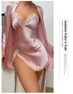 Close-up of pink satin nightgown and robe set featuring elegant beige lace embroidery