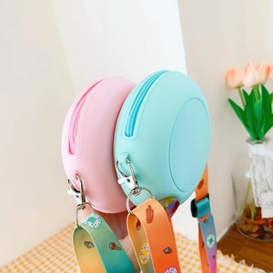 Detail of pink and mint green silicone donut bags with colorful dessert printed straps
