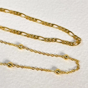 Elegant gold S925 sterling silver Figaro chain bracelet with decorative round beads