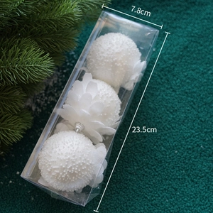 Three white glitter Christmas balls with flower bases in a box measuring 7.8cm by 23.5cm