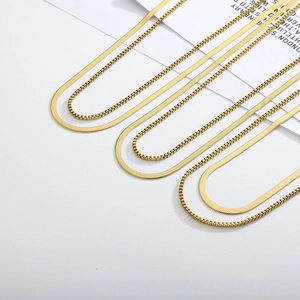 Double-layered gold flat snake and box chain necklace in minimalist fashion style
