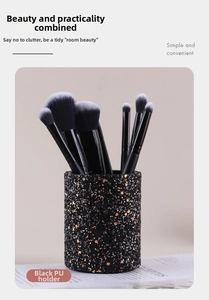 Detail view of the black sequined PU leather makeup brush holder with a glittery finish