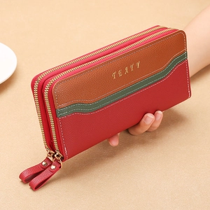 Detailed view of color-block pebbled leather wallet with double gold-tone zippers