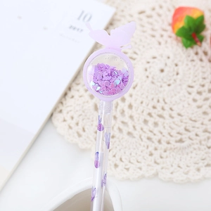 Purple glitter gel pen with butterfly motif and heart-shaped sequins in a clear round top