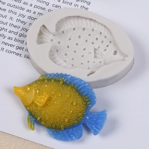 Macro view of silicone mold showing detailed fish scale textures and fin patterns