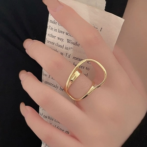 Detail of 925 silver double layer oval ring with minimalist gold hollow irregular lines