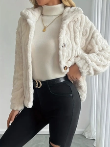Women's white fleece zip jacket with hood paired with black slim jeans for casual style