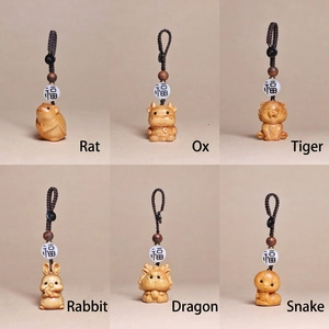 Handcrafted wooden Chinese zodiac charms including rat, ox, tiger, and rabbit with Fu bead