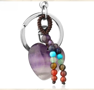 Detail of heart amethyst keychain with colorful gemstone beads and woven tassel