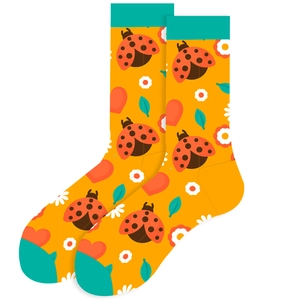 Close-up of yellow mid-calf socks with cute ladybug and floral patterns for women