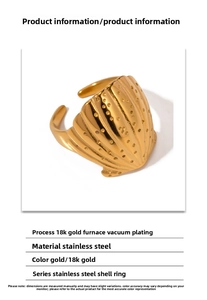 Macro detail of 18K gold plated stainless steel ring with 3D shell texture and open design