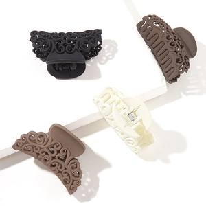 Set of four matte hollow shark hair claws in black, deep brown, khaki, and cream colors