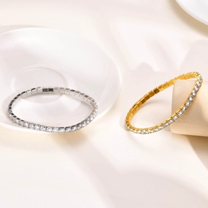 Detail of silver and gold tennis bracelets with sparkling zircons on elegant stands