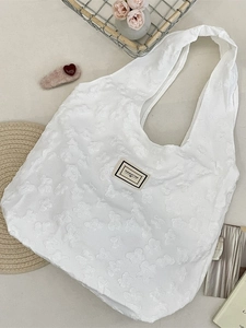 White jacquard shoulder bag with 3D floral texture and Pleasant Time woven label