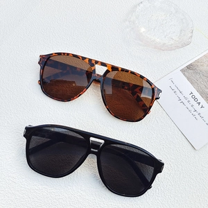 Oversized retro rimless sunglasses in classic black and leopard print styles