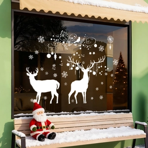 White Christmas window decals with elk and snowflakes on glass for holiday home decoration