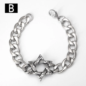Detail of silver stainless steel curb chain bracelet with star pendant and lobster clasp