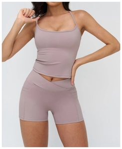 Detailed front view of high-waisted yoga shorts with crossover waist and side pockets