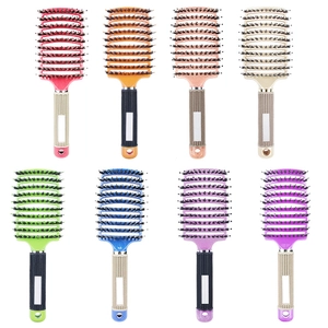 Curved boar bristle hairbrushes in eight vibrant colors for professional hair styling
