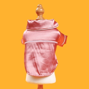 Detail of pink silk satin pet pajama shirt for small dogs and cats shown on a mannequin
