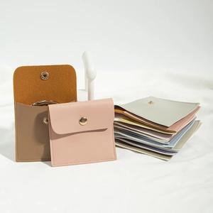 Multiple Morandi colored PU leather jewelry pouches with golden snap button closure